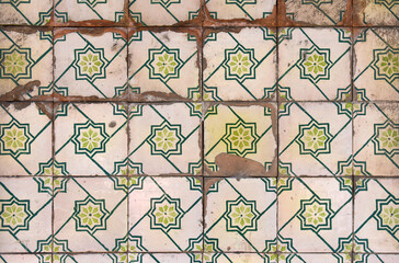 old damaged tiles in Portugal, grenen and white color, photography takes in buildings of Portugal