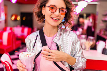 stylish smiling woman in retro vintage cafe