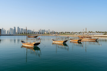 Fototapeta na wymiar Traditional boats called Dhows are anchored in the port near the Museum of Islamic Art Park Doha, Qatar
