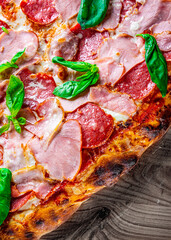 Obraz na płótnie Canvas flatbread Pepperoni roman Pizza with Mozzarella cheese, salami, ham, Tomato sauce, pepper, Spices. Italian pizza on wooden background