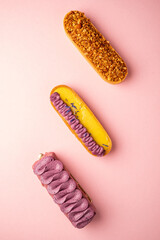 french eclairs on the pink background