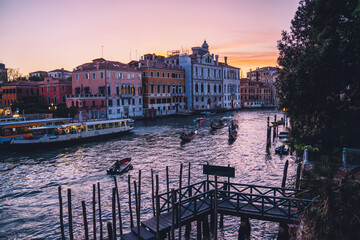 Venice Italy - overview on Grand Canal with boat and gondola taxi station and old houses along...
