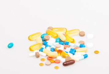 Various vitamins and nutritional supplements on the white background with shallow dof
