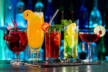 Set of coctails on bar counter in a restaurant, pub. Collection of fresh juice alcoholic drinks....