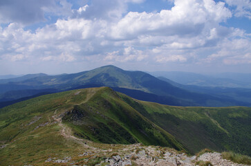 Mountain panoramic landscape with clouds and blue sky