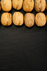Ripe walnuts on black background. Studio Photo
