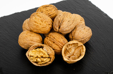 Ripe walnuts on black background. Studio Photo