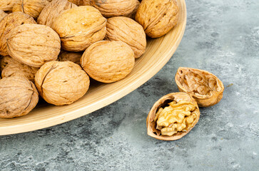 tasty Unpeeled walnuts, background, texture. Studio Photo