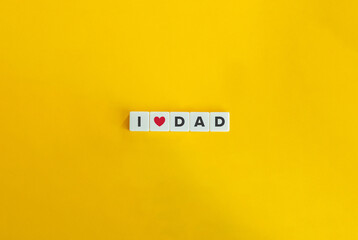 I Love Dad Banner. Letter tiles on bright orange background. Minimal aesthetics.