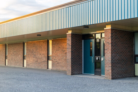 Elementary school brick building front. Entrance door