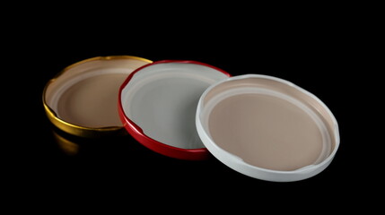 Jar lids isolated on black  