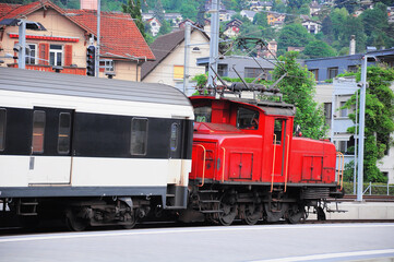 Naklejka premium Passenger train arrives to the platform. Chur.