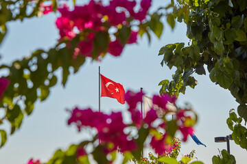 Turkish flag and on the shores of the mediterranean sea, during the covid 19 pandemic