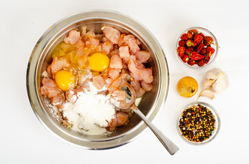 Pieces of chicken fillet, raw eggs, spices for cooking. Studio Photo