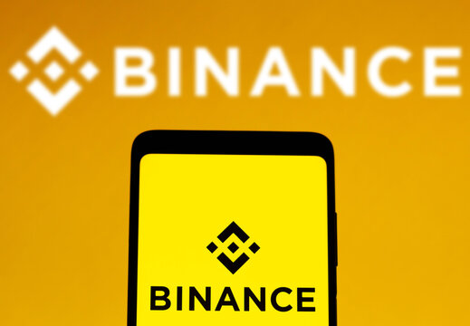 February 1, 2022, Brazil. In this photo illustration, the Binance logo is displayed on a smartphone screen and in the background.