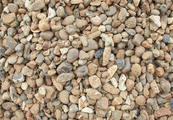 A texture made of a pile of racetrack gravel. aroma stone, pebbles on the beach, rock stone background
