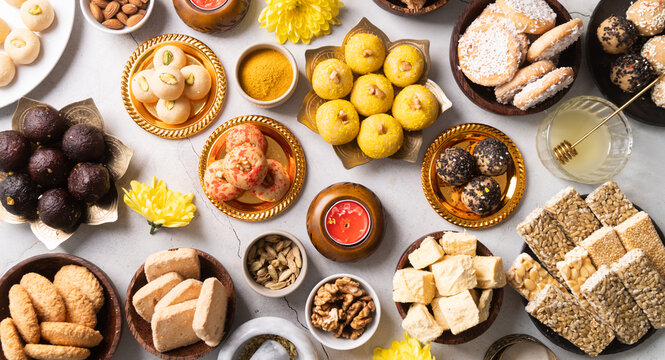 traditional indian sweets on concrete background flat lay