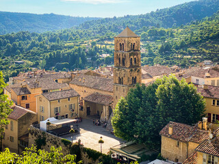 Village of Moustiers Sainte Marie in Provence, France with a view on the bell tower of the...