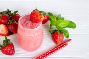 Strawberry yogurt fruit juice smoothie pink colorful fruit juice milkshake blend beverage healthy high protein the taste yummy In glass drink episode morning on white wood background.
