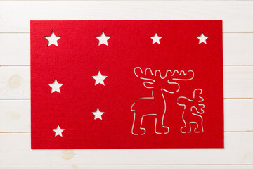 Top view of red tablecloth for food on wooden background. Empty space for your design