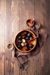 Sweet Gulab Jamun in wooden bowl on rustic background
