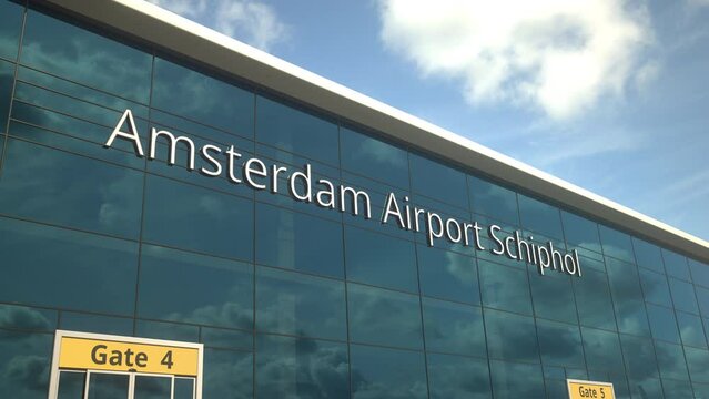 Airliner landing reflecting in the windows with Amsterdam Airport Schiphol text