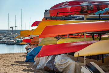 Boats, canoes stacked in the seaport