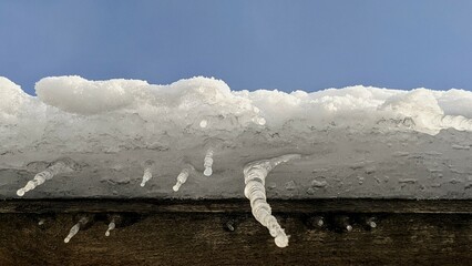 icicles on the roof of a house