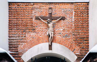 Large cross with crucifixion of Jesus on the facade of the ancient Armenian Catholic cathedral in...