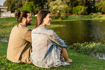 brazilian couple enjoying time together and smiling in the grass
