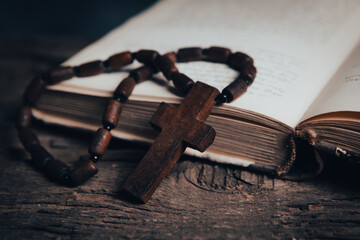 open book and cross on the table