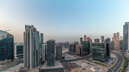 Naklejka na ściany i meble Business Bay Dubai skyscrapers with water canal aerial timelapse.