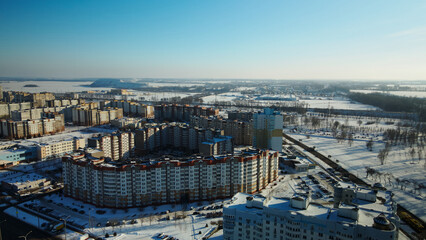 Fototapeta premium City block. Modern multi-storey buildings. Winter cityscape. Aerial photography.