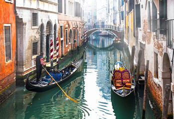 Fototapeta na wymiar Beautiful romantic Venice town, narrow canals and gondolas.Gondola trip. Italy travel and landmarks