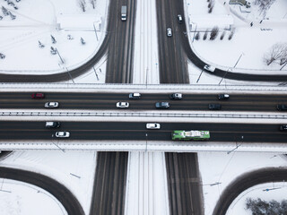 Transport junction traffic road. Aerial high above view of modern road junction. Top down aerial winter view of a road. Two-level intersection of two highways