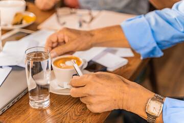 Taking his coffee, selective focus