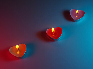 burning colored scented heart shaped candles