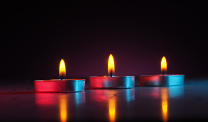 burning colored scented heart shaped candles