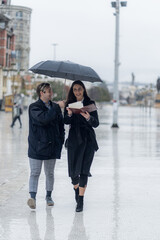 Walking with her assistent and smiling