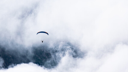 A speedwing flying in the clouds in the Alps