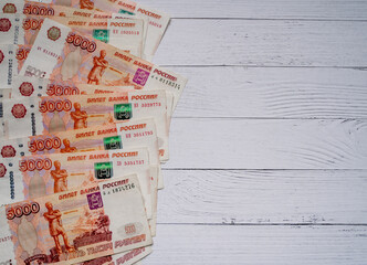 banknotes money lie on the table Russian five thousand rubles a lot of money Russia on a light...