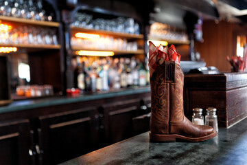 A pair of Boots on a bar