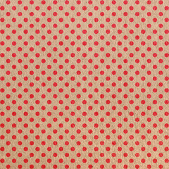 Red polka dot pattern on craft paper surface texture 