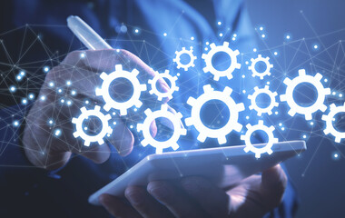Man using tablet. Gears and network. Industry. Business. Solution. Technology
