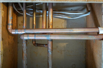 Underfloor copper water pipes in a house