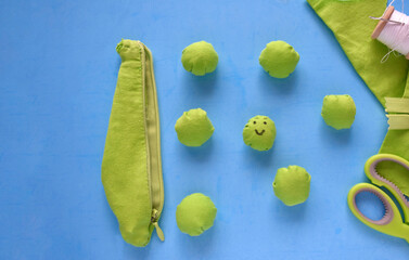 making toys for children green peas on a blue background
