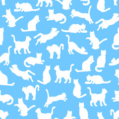 Seamless pattern with silhouettes of cats