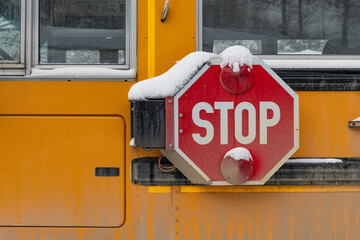 Snow Covered Stop Arm on a Yellow School Bus - obrazy, fototapety, plakaty