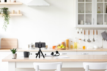 Workplace, technology for work at home in minimalist kitchen interior, nobody