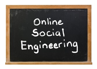 Online social engineering written in white chalk on a black chalkboard isolated on white